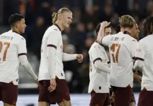 In a dazzling display of skill and dominance, Erling Haaland reclaimed his throne with a jaw-dropping five-goal spectacle, propelling Manchester City to a resounding 6-2 victory over Luton Town at Kenilworth Road, securing their spot in the FA Cup quarterfinals. Luton found themselves powerless against the relentless onslaught of the Norwegian maestro, who notched his eighth City hat-trick before the halftime whistle and added two more goals in the second half, extinguishing any hopes of a Luton resurgence. The 23-year-old sensation orchestrated his masterpiece with four of his goals orchestrated by the impeccable Kevin De Bruyne, while Mateo Kovacic joined the scoring fray for the reigning champions, who continue their unbeaten streak spanning 18 games across all competitions. Despite a brief glimmer of hope for Luton with Jordan Clark's exquisite strikes just before halftime and early in the second half, City promptly shifted into overdrive, effortlessly securing their berth in the quarterfinal draw. Haaland etched his name in the annals of football history, becoming the first top-flight player to grace the FA Cup with a five-goal performance since George Best's legendary feat for Manchester United in 1970. The only setback for City was the injury to Jack Grealish, who was forced off in the early stages of the match. After enduring a spell of relative quiet with just five goals in his previous 11 appearances, Haaland silenced any whispers of doubt with a virtuoso display, reaffirming his status as a premier striker in world football. City asserted their dominance from the outset, seizing the lead in the fourth minute as Matheus Nunes fed De Bruyne, who delivered a precision pass for Haaland to unleash a thunderous strike past Tim Krul. De Bruyne continued to serve as Haaland's architect, setting up the Norwegian once more in the 18th minute, while Haaland's hat-trick goal mirrored his earlier exploits, courtesy of another exquisite De Bruyne assist. Clark momentarily lifted the spirits of the home crowd with a sublime curler past Stefan Ortega, but City's defensive lapse allowed Luton to capitalize, with Clark finding the net once more shortly after the restart. However, Haaland swiftly extinguished any hopes of a miraculous comeback, converting another De Bruyne pass before completing his quintet with assistance from Bernardo Silva, before being substituted to the relief of the Luton faithful. In parallel action, second-tier leaders Leicester City punched their ticket to the quarterfinals with a hard-fought 1-0 victory over Premier League outfit Bournemouth, joining Pep Guardiola's side in the next stage of the FA Cup journey.